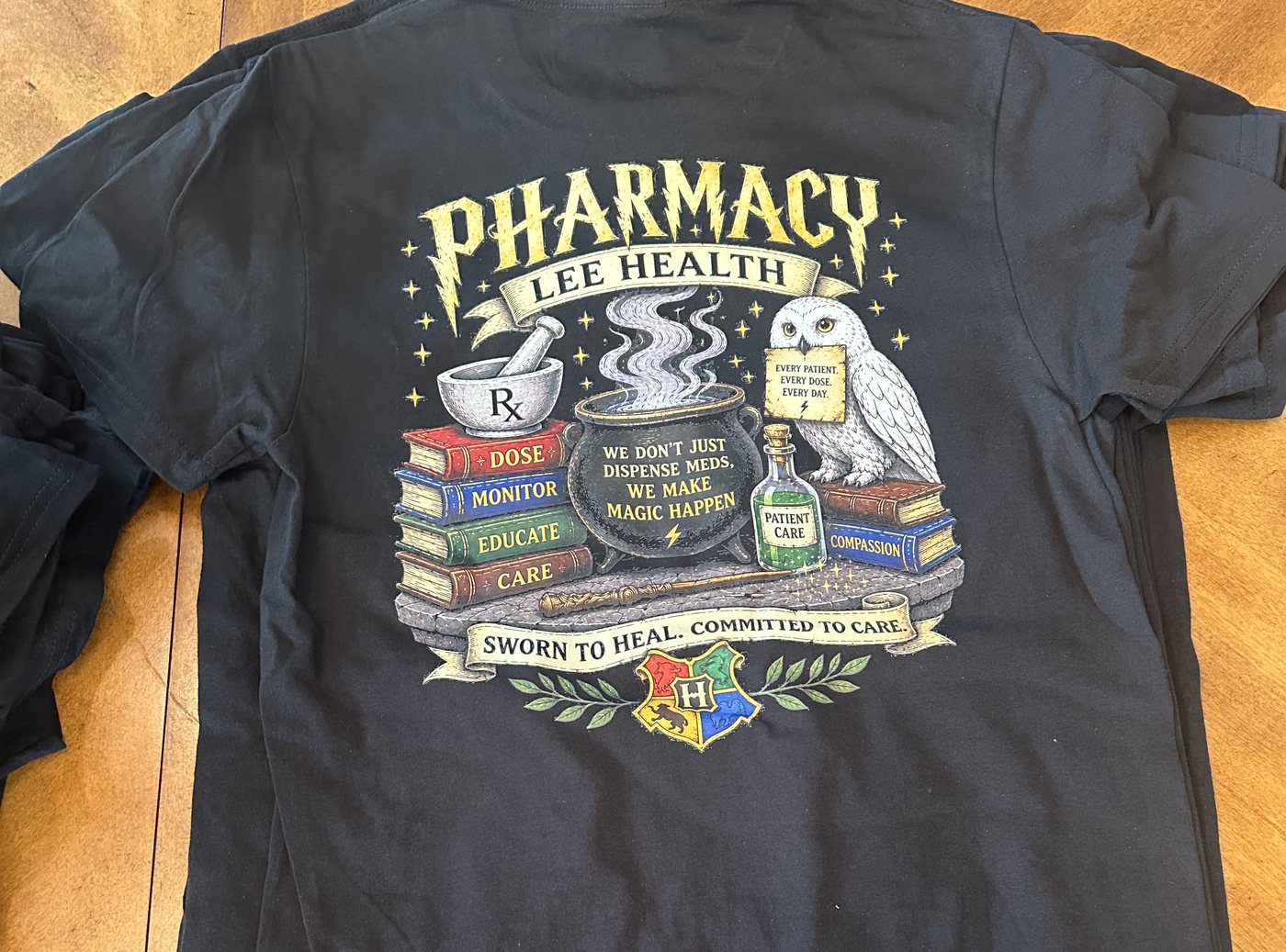 Black tee with a detailed full-color DTF pharmacy team back print
