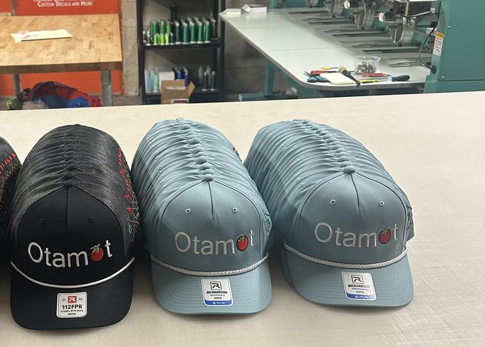 Rows of custom embroidered trucker hats