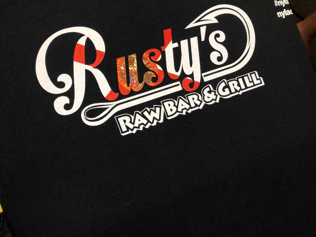 Black Rusty's Raw Bar & Grill tee with the white and red logo