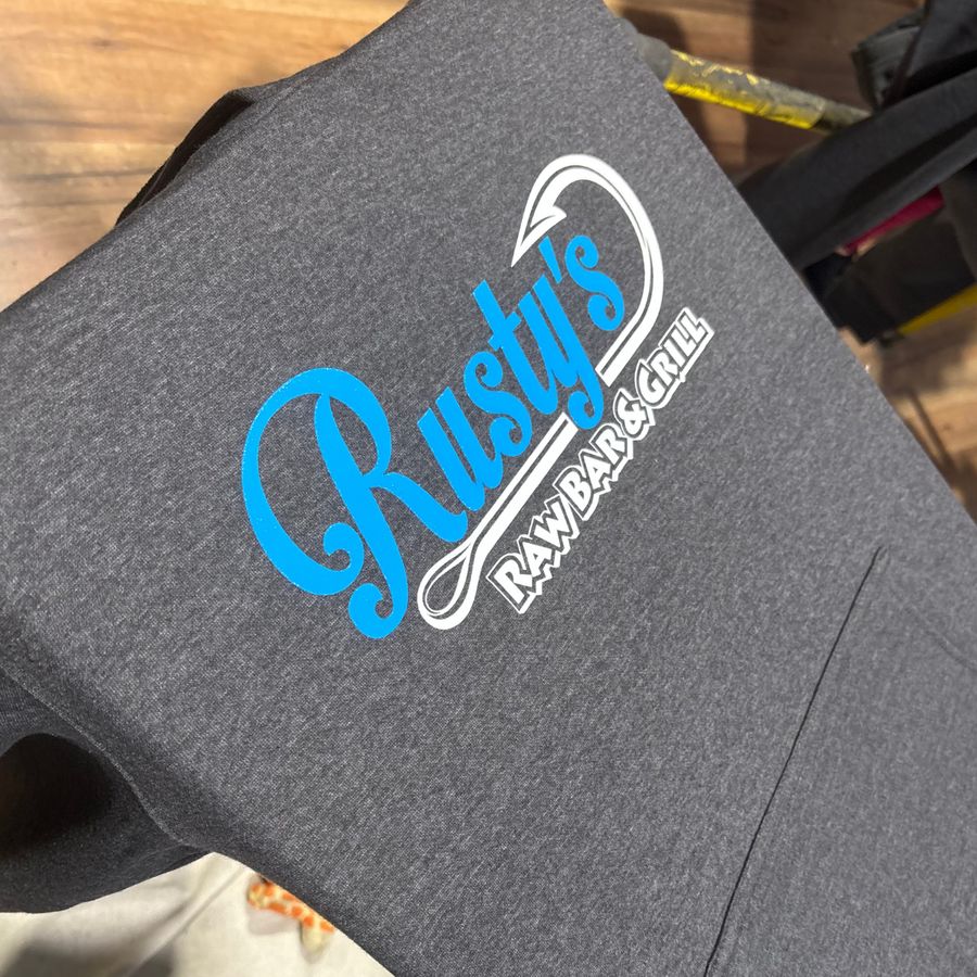 Grey tee with a blue Rusty's Raw Bar & Grill logo