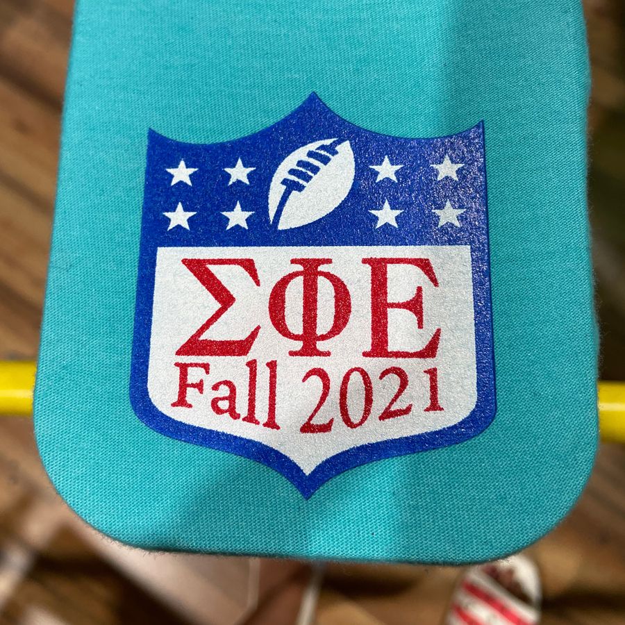 Teal tee with a Sigma Phi Epsilon Fall 2021 shield