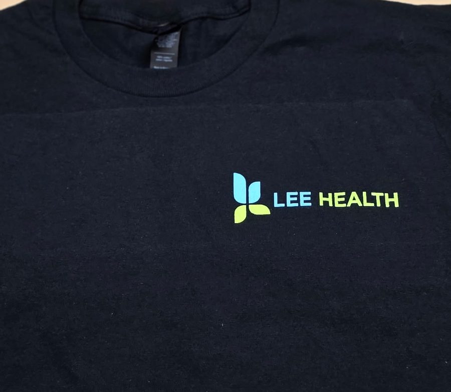 Black tee with a two-color Lee Health left chest logo