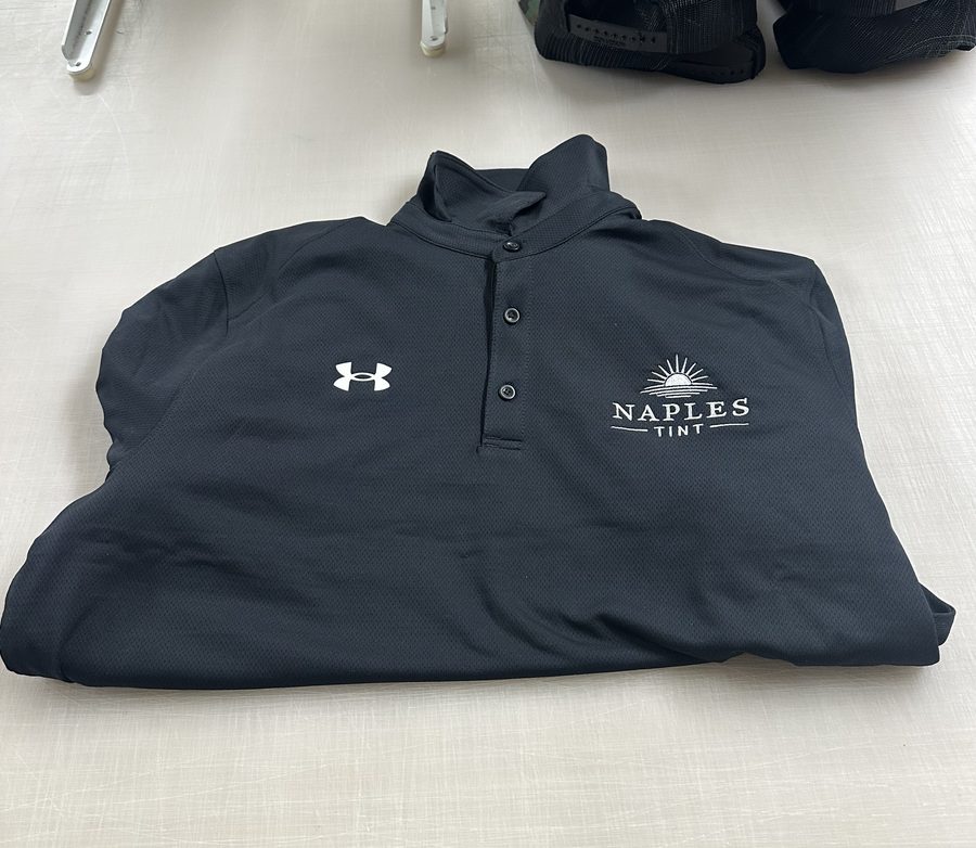 Navy performance polo with an embroidered logo